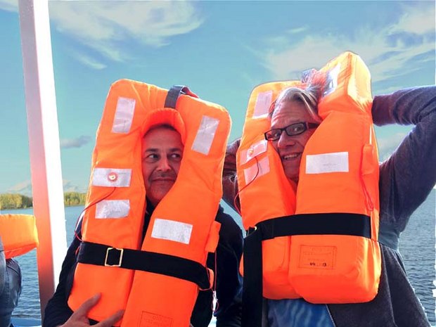 Alexey Alekseev and Nik modelling life jackets during the onboard emergency drill
