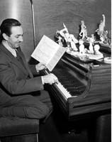 Walt Disney at the piano.