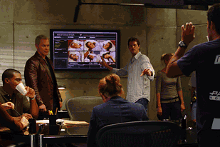 Jaison Stritch (in white shirt pointing to screen) of Stargate Digital and vfx supervisor of Medical Investigation, credits cutting-edge technology and the crack team of four vfx artists with producing some 25 vfx shots per episode.
