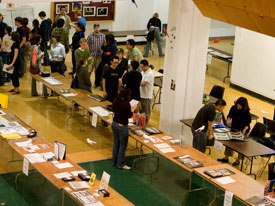 Some 40 companies show up for CalArts year- end portfolio review. The schools main gallery is filled with rows of tables for students portfolios, résumés and reels for the visiting recruiters. Photo credit: Scott Groll