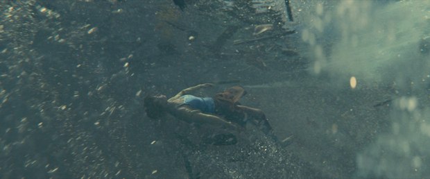 Scanline created a CG double of the water to match the live-action water, and used tennis balls to locate the exact motion pattern of the actress underwater.