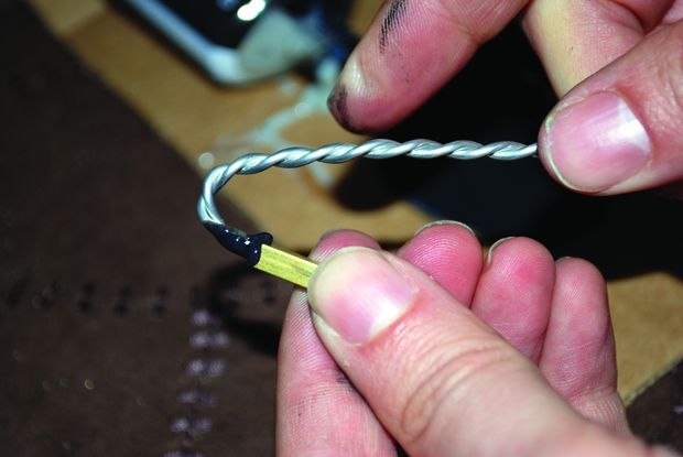 [Figure 3.10] Gluing wires into the K&S tubes.
