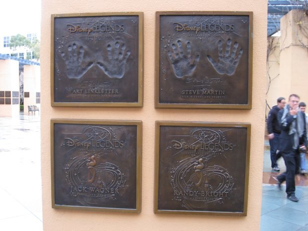 Pillars surrounding the Disney Legends Plaza are adorned with handprints from the famed inductees.