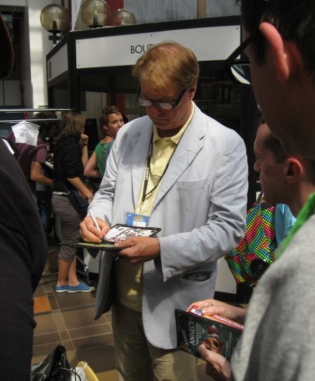 Bill signing his new book, "Independently Animated: Bill Plympton!"