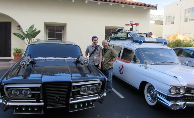 Patrick and Michael beside two very famous movie rides. The Ghostbusters Ectomobile is a working model, while the Green Hornet's Black Beauty has no engine.