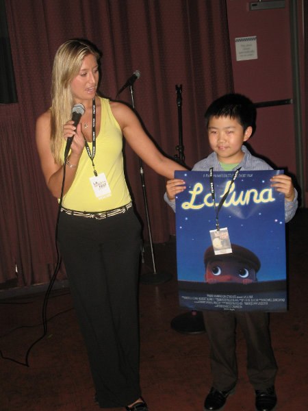 Perry Chen holding La Luna poster at LA Shorts Fest screening, July 2011 (photo by Zhu Shen)