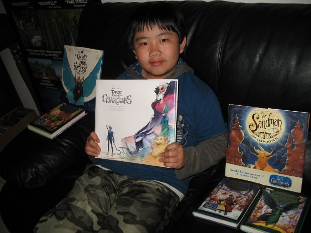 Perry Chen with Art of Rise of Guardians book and "Guardians of Childhood" book series (photo by Zhu Shen)