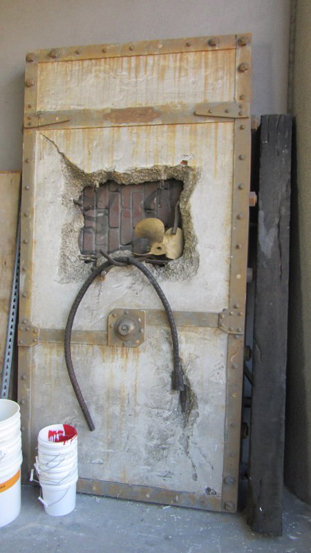 A blasted cement door, complete with exposed rebar, from the X-Files TV show. It