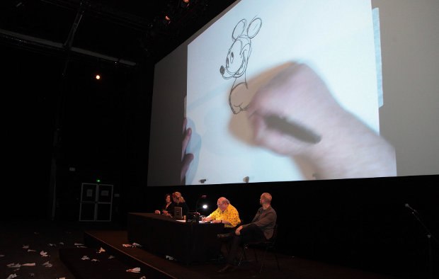 Eric delighted the crowd with his drawings of both the 1928 and 2013 Mickey Mouse.