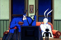 The Tick and his sidekick Arthur watching TV. From the animated series, The Tick. © Fox Children's Network.