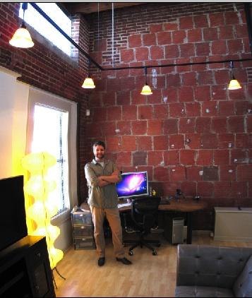 Motion Graphics Artist Brian Simpson in his suite at Intake Studio's new Kansas City satellite company