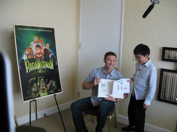 Perry Chen and Travis Knight showing off their ParaNorman drawings.