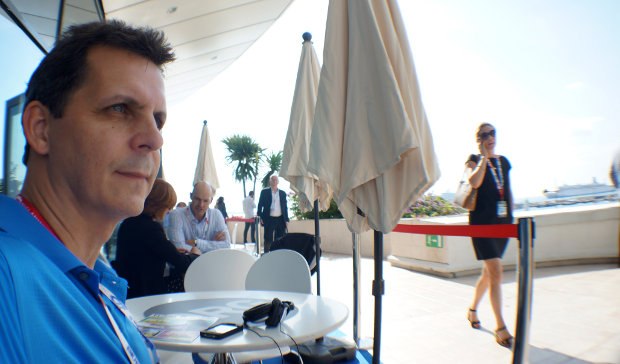 Mark waiting for a meeting at MIPCOM as he looks over the French Riviera. He has a trick to get past the Hollywood Gate Keepers.