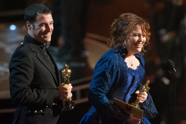 Mark Andrews and Brenda Chapman accept the Oscar® for best animated feature film of the year for work on Brave. Image credit: Darren Decker / ©A.M.P.A.S.