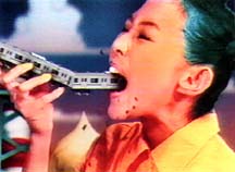 A blue-haired girl eats a passenger train in Kutchae!, an animated i.d. directed by Isao Nishigori for MTV Japan.  1996 Music Channel Co., Ltd.