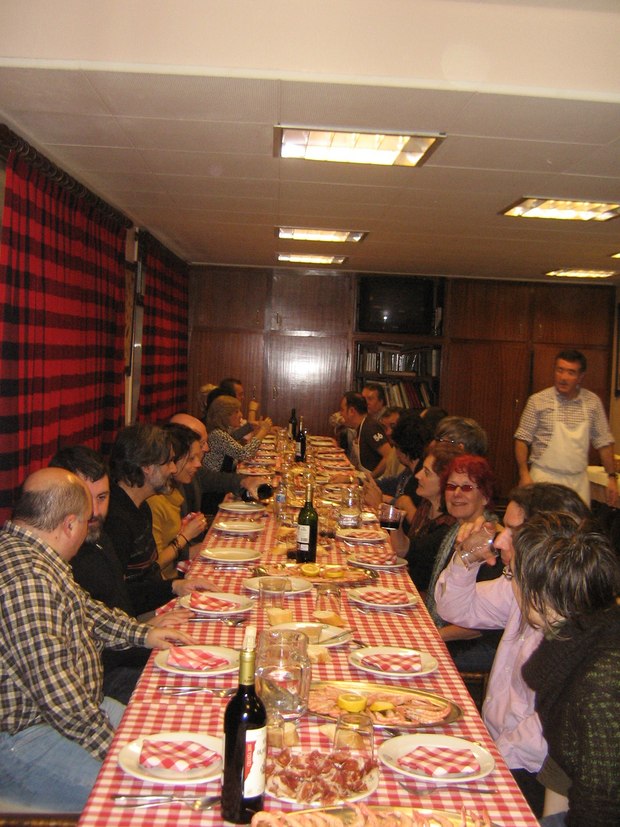 Festival guests and staff dining at the Spanish men's eating club