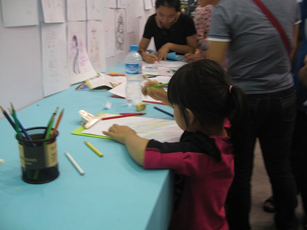 Future animators practising at the exhibition