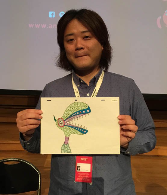 Mirai Mizue with one of his drawings