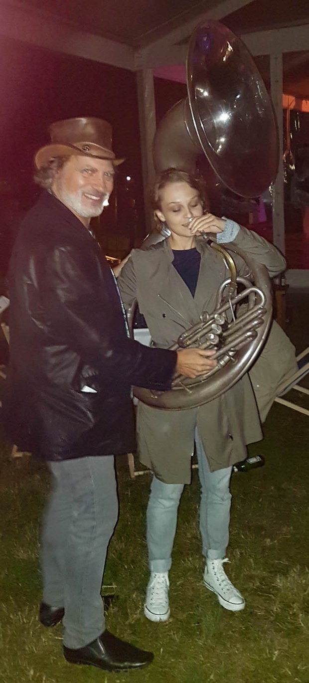 Marta Pajek tries out playing David Silverman's tuba
