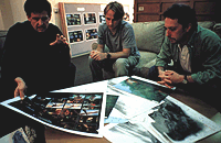 Background supervisor Kevin Turcotte (left), background painter Paul Duncan (middle) and art director Paul Lasaine study some of the landscapes for the film. TM & © 2000 DreamWorks LLC.