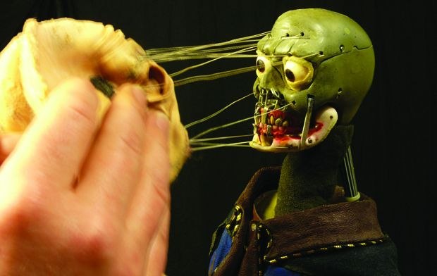 [Figure 3.98] Isomer’s skin is peeled back to reveal his skull armature underneath. (© Ron Cole.)