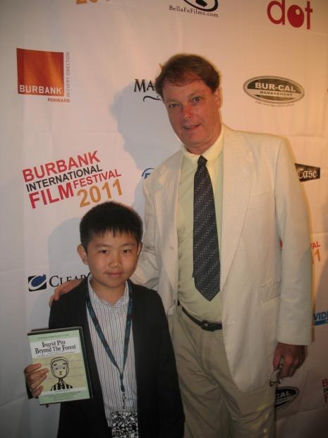 Perry Chen with Bill Plympton and their film “Ingrid Pitt: Beyond the Forest” at 2011 Burbank International Film Festival (photo by Zhu Shen.
